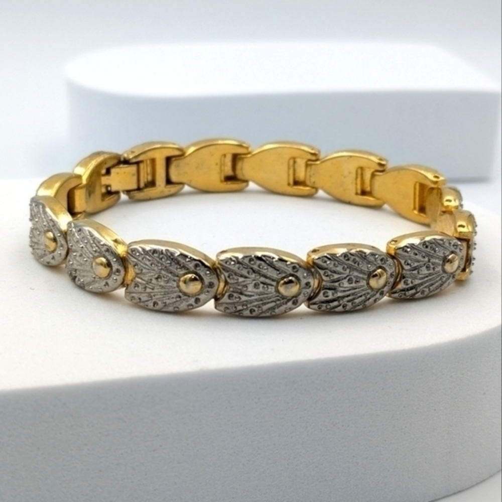 5/25$  Art deco style gold tone and silver tone bracelet
